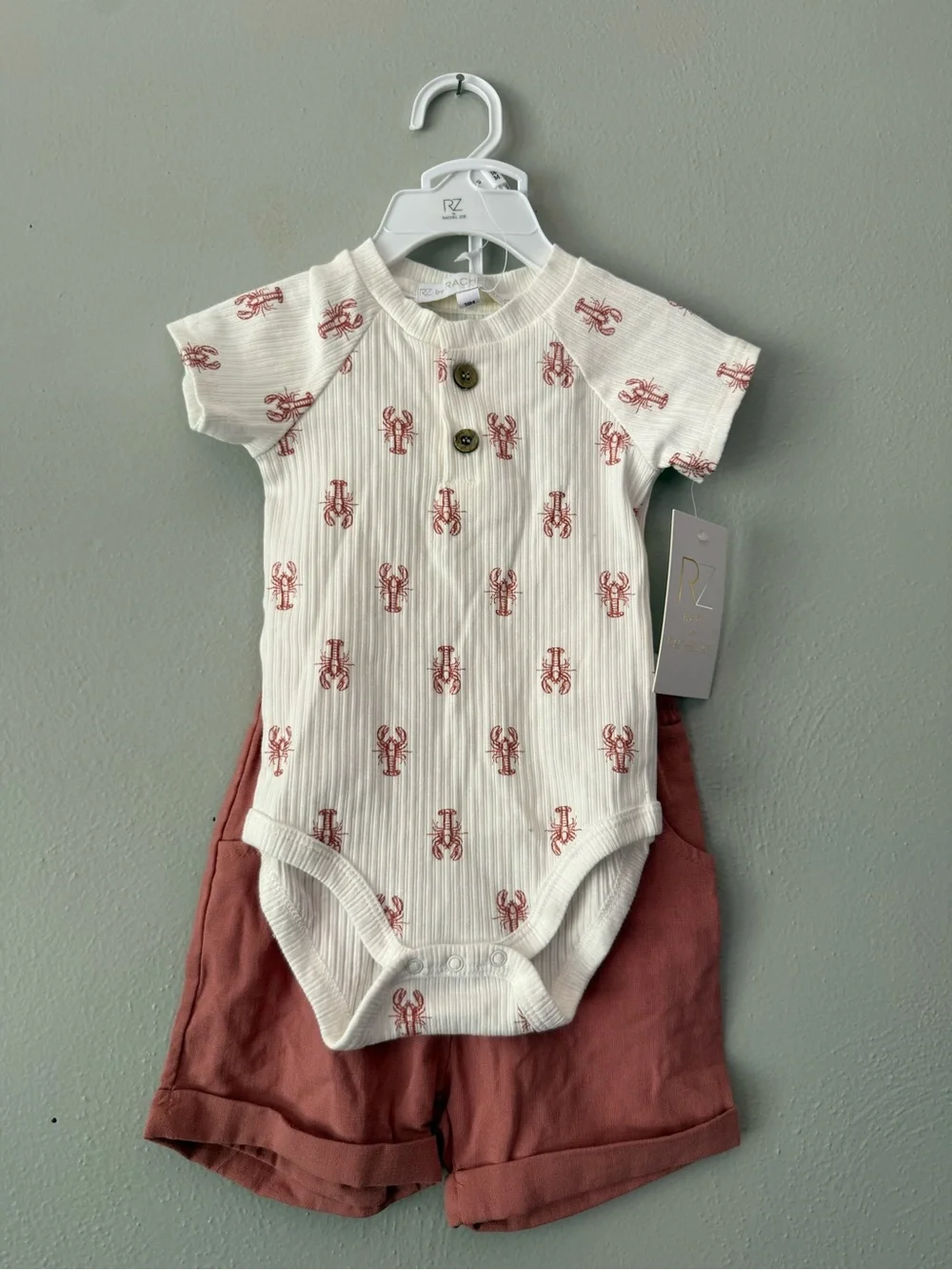Rachel Zoe Baby Cream Onesie with Rust Lobster Print